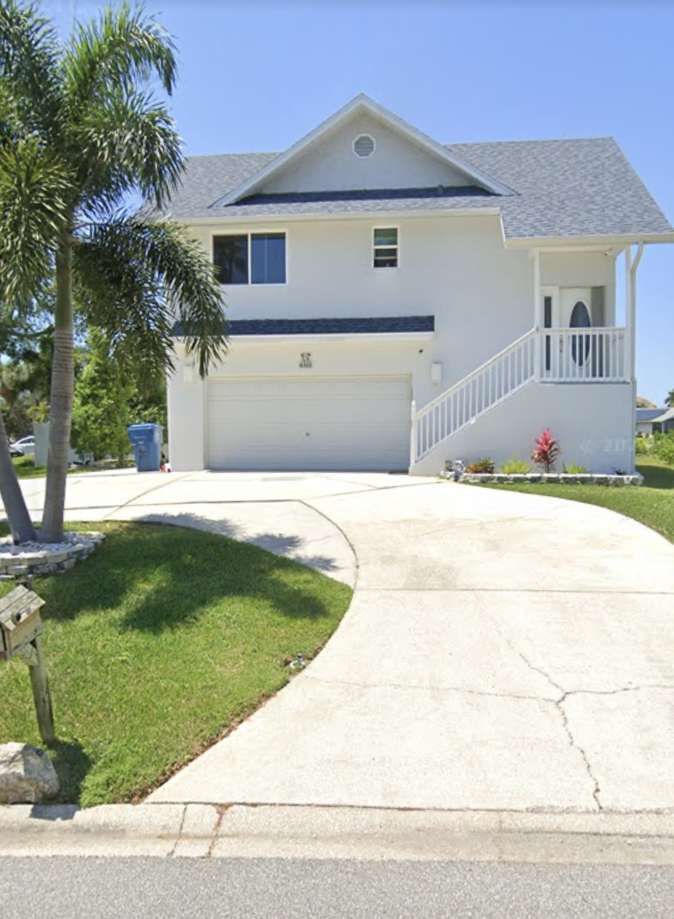 White residential home and driveway